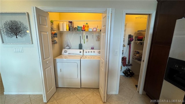 18130 Millstone Cove Rd Unit 447, Gravois Mills, MO 65037 - washroom with independent washer and dryer and light tile patterned flooring