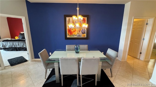 18130 Millstone Cove Rd Unit 447, Gravois Mills, MO 65037 - dining room with light tile patterned floors, a chandelier, baseboards, and an accent wall