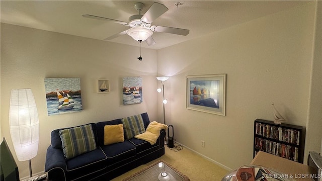 18130 Millstone Cove Rd Unit 447, Gravois Mills, MO 65037 - carpeted living area featuring a ceiling fan and baseboards