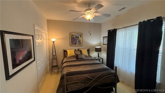 18130 Millstone Cove Rd Unit 447, Gravois Mills, MO 65037 - bedroom featuring light carpet and a ceiling fan