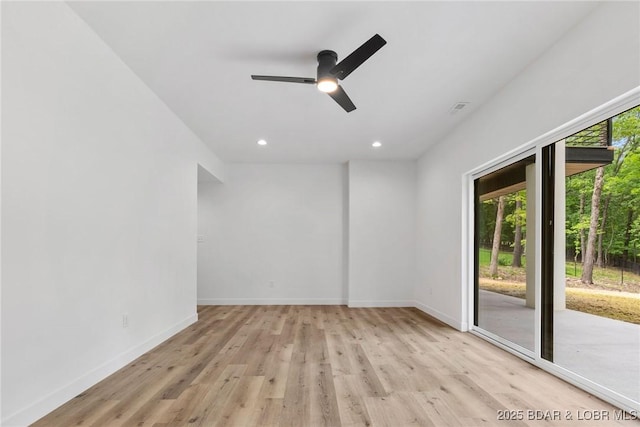 spare room with light wood-type flooring, a ceiling fan, baseboards, and recessed lighting