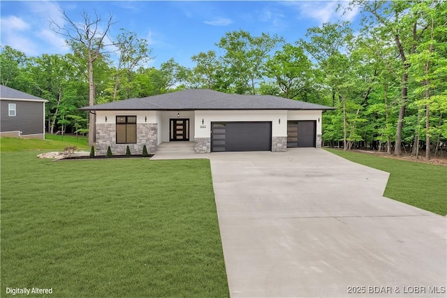 prairie-style house featuring stone siding, an attached garage, driveway, and a front yard