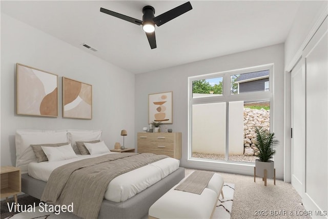 carpeted bedroom with ceiling fan