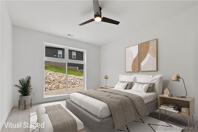 carpeted bedroom with a ceiling fan and baseboards