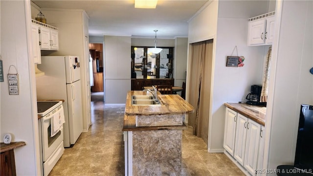 kitchen with a sink, white appliances, white cabinetry, hanging light fixtures, and wooden counters
