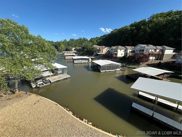 dock area with a water view and a residential view