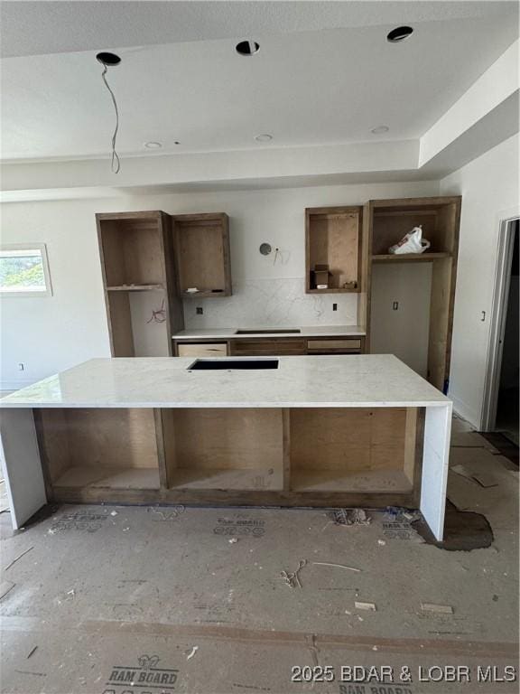 kitchen featuring a spacious island and open shelves