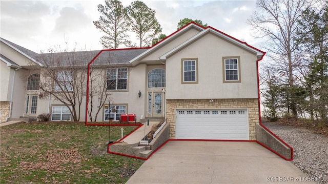 30 Mitchell Rd, Lake Ozark, MO 65049 - raised ranch featuring driveway, stone siding, an attached garage, and stucco siding
