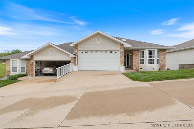 5183 Vicus Castri, Osage Beach, MO 65065 - ranch-style house with an attached garage, driveway, brick siding, and a front yard