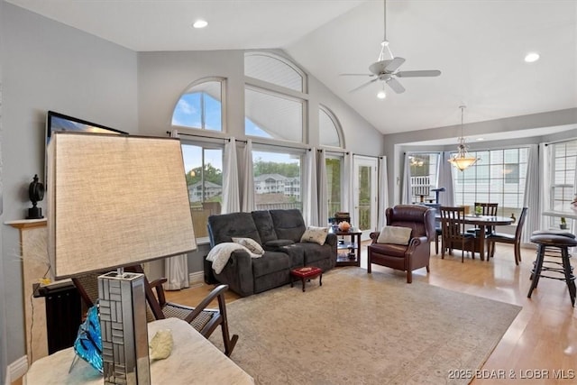 5183 Vicus Castri, Osage Beach, MO 65065 - living room featuring vaulted ceiling, light wood-style floors, a ceiling fan, and recessed lighting