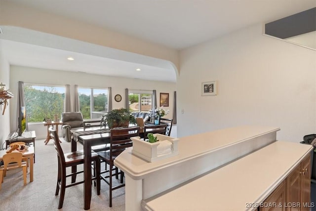 5183 Vicus Castri, Osage Beach, MO 65065 - dining space with light carpet, recessed lighting, and arched walkways