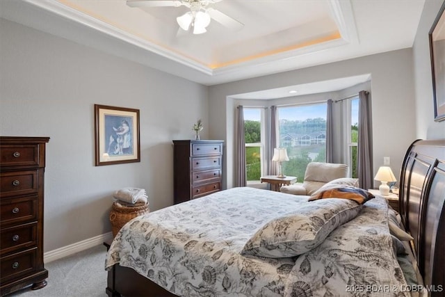 5183 Vicus Castri, Osage Beach, MO 65065 - bedroom with a tray ceiling, light carpet, baseboards, and a ceiling fan