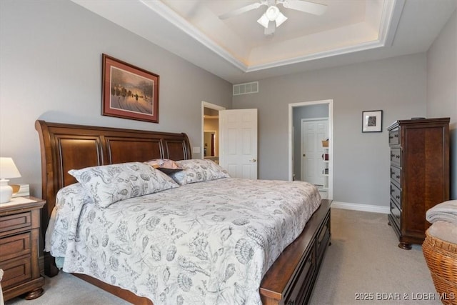 5183 Vicus Castri, Osage Beach, MO 65065 - bedroom with light colored carpet, a raised ceiling, baseboards, and a ceiling fan
