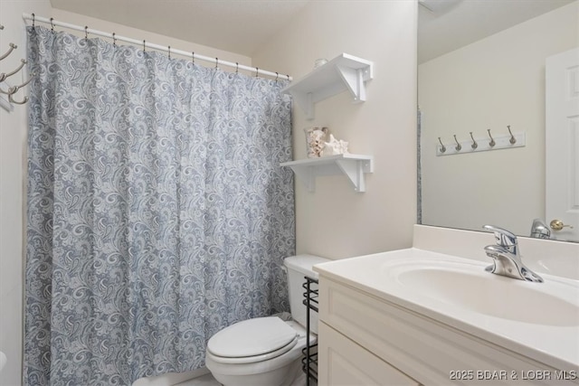 5183 Vicus Castri, Osage Beach, MO 65065 - full bathroom featuring toilet, vanity, and a shower with curtain