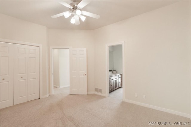 5482 Stoneledge Cir, Osage Beach, MO 65065 - unfurnished bedroom featuring light carpet, baseboards, a closet, and ceiling fan