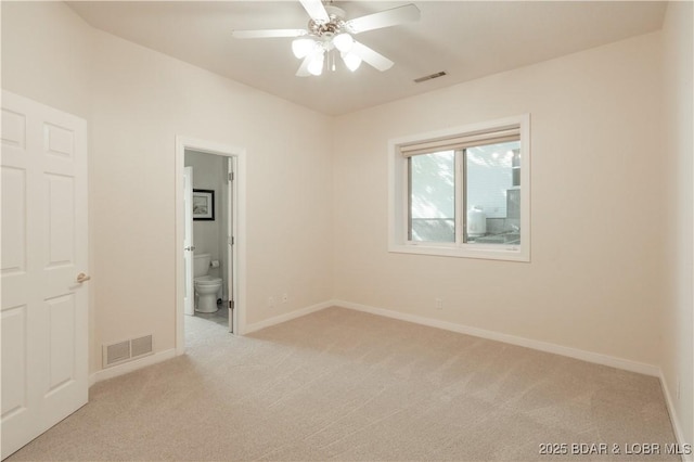 5482 Stoneledge Cir, Osage Beach, MO 65065 - unfurnished bedroom with carpet, baseboards, connected bathroom, and a ceiling fan