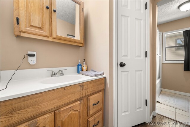 66 Old Shawnee Bend Rd, Sunrise Beach, MO 65079 - bathroom with a textured ceiling and vanity