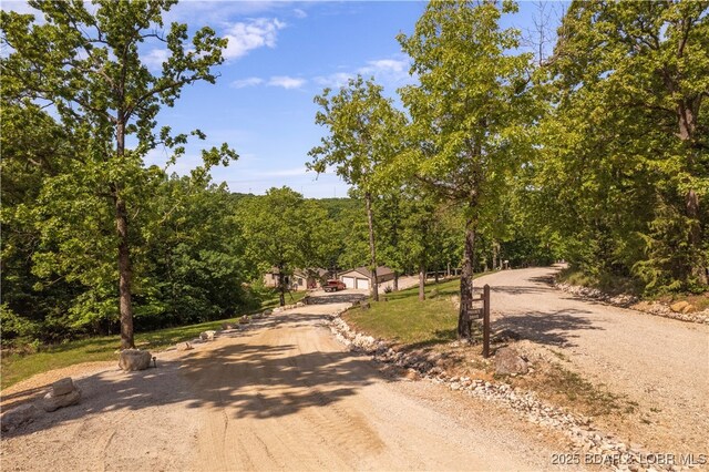 66 Old Shawnee Bend Rd, Sunrise Beach, MO 65079 - view of dirt / gravel road featuring a forest view