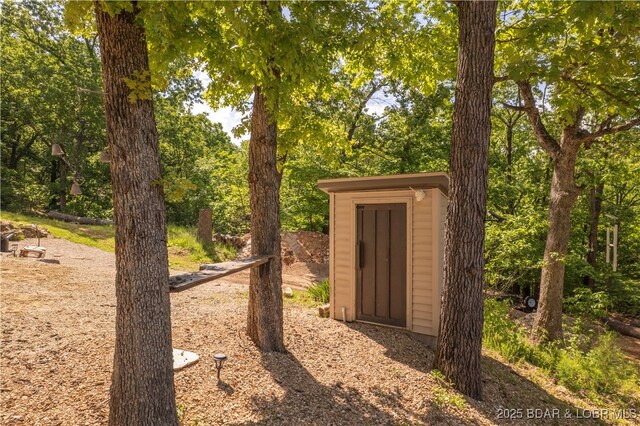 66 Old Shawnee Bend Rd, Sunrise Beach, MO 65079 - view of yard featuring a storage shed and an outdoor structure