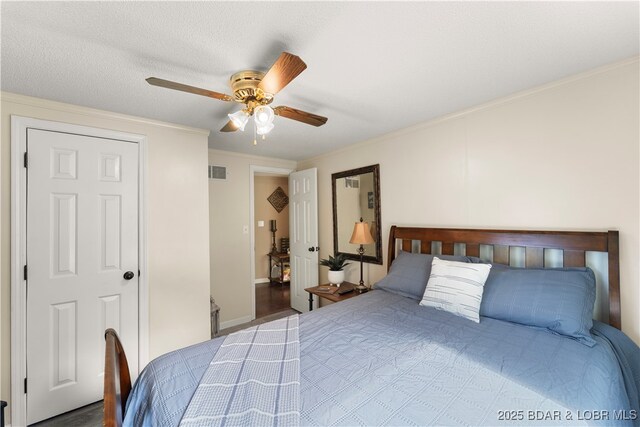 66 Old Shawnee Bend Rd, Sunrise Beach, MO 65079 - bedroom featuring ornamental molding, ceiling fan, and wood finished floors