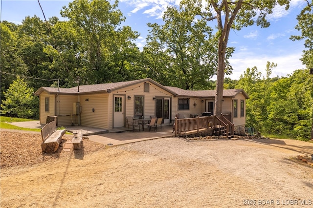 66 Old Shawnee Bend Rd, Sunrise Beach, MO 65079 - back of house featuring a wooden deck and a patio area