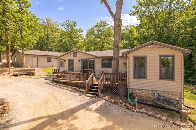 66 Old Shawnee Bend Rd, Sunrise Beach, MO 65079 - view of front of house featuring a wooden deck