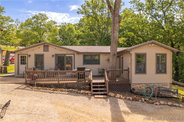 66 Old Shawnee Bend Rd, Sunrise Beach, MO 65079 - view of front of home with a deck and view of scattered trees