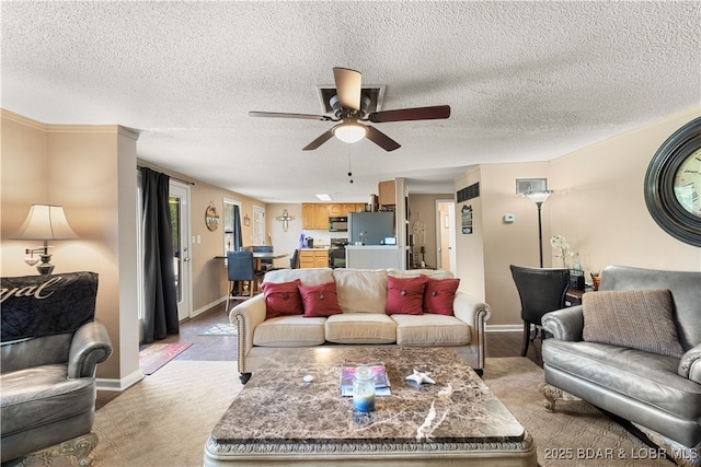 66 Old Shawnee Bend Rd, Sunrise Beach, MO 65079 - living room featuring a ceiling fan, a textured ceiling, and baseboards