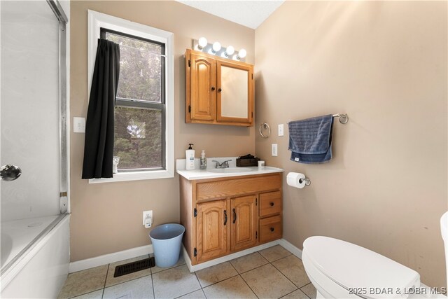66 Old Shawnee Bend Rd, Sunrise Beach, MO 65079 - bathroom featuring baseboards, vanity, toilet, and tile patterned flooring