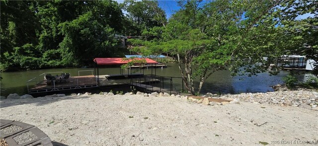 66 Old Shawnee Bend Rd, Sunrise Beach, MO 65079 - view of yard with a floating dock and a water view