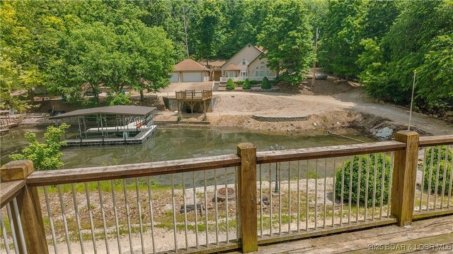 26587 Lake Front Ln, Rocky Mount, MO 65072 - view of yard featuring a boat dock and a water view