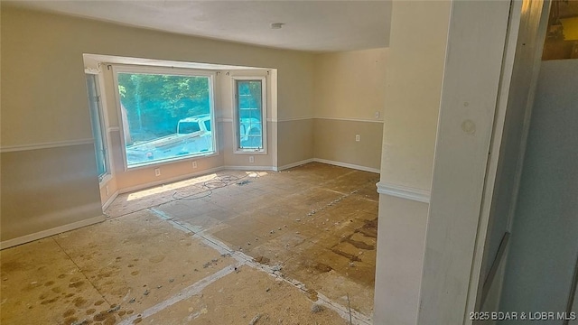 26587 Lake Front Ln, Rocky Mount, MO 65072 - spare room featuring baseboards