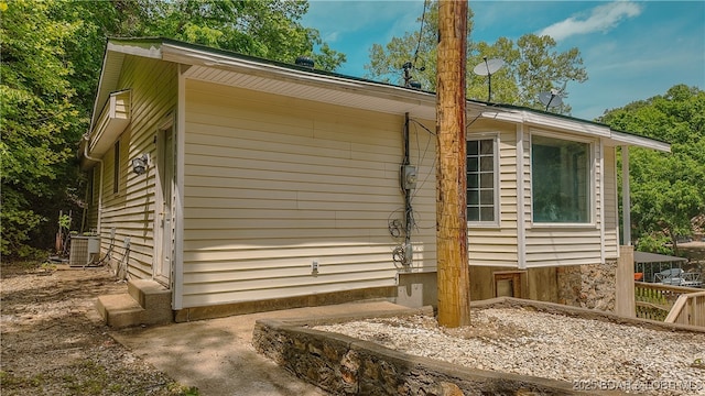 26587 Lake Front Ln, Rocky Mount, MO 65072 - view of side of home with central air condition unit