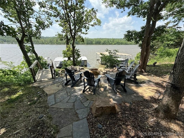 23848 Bill Bryant Dr, Warsaw, MO 65355 - view of patio / terrace featuring an outdoor fire pit and a water view