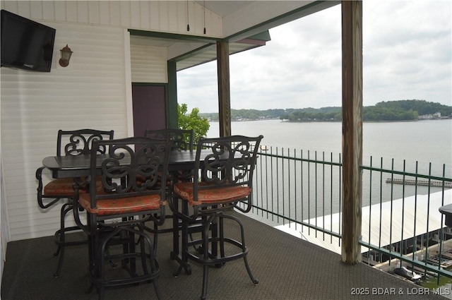 sunroom / solarium with a water view
