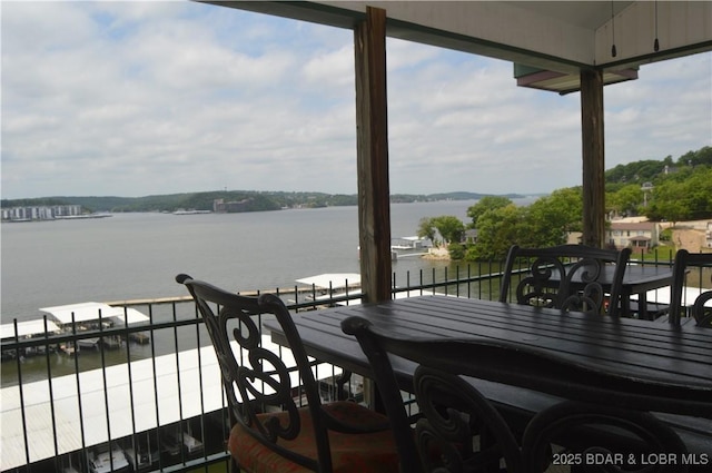 wooden deck with a water view