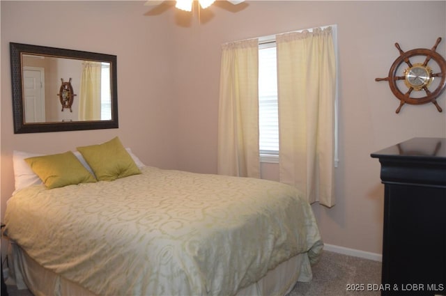 carpeted bedroom with baseboards and ceiling fan