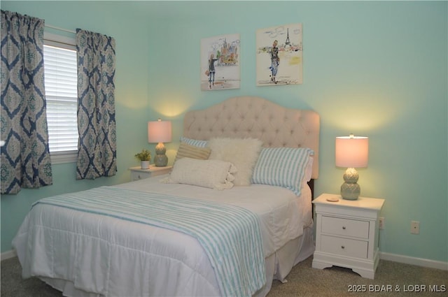 bedroom with carpet flooring and baseboards