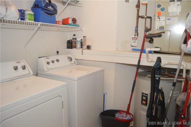 washroom with independent washer and dryer and water heater