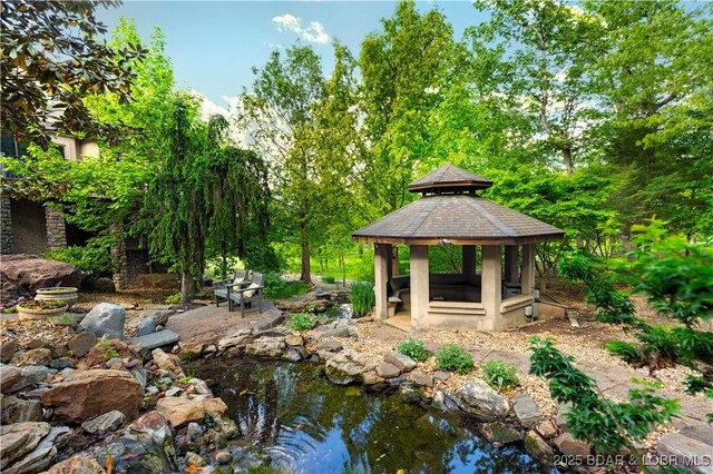 126 W Cross Fox Trl, Camdenton, MO 65020 - view of home's community with a gazebo and a small pond