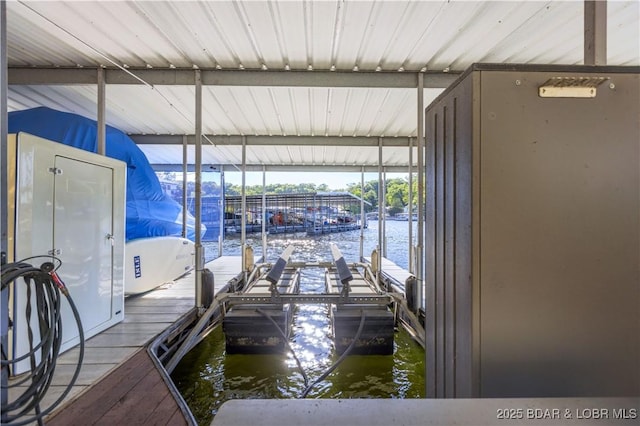 dock area with a water view and boat lift