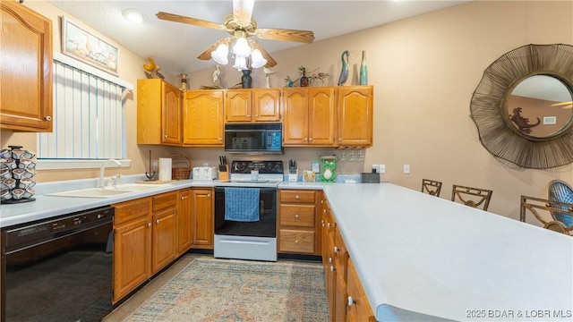 611 Lazy Days Rd Unit X-10, Osage Beach, MO 65065 - kitchen with black appliances, a sink, ceiling fan, and light countertops