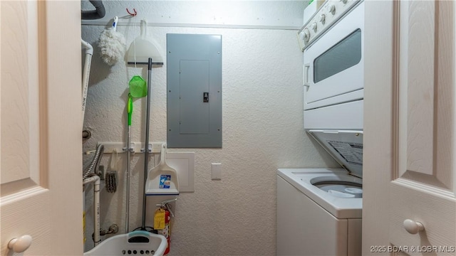 611 Lazy Days Rd Unit X-10, Osage Beach, MO 65065 - clothes washing area featuring electric panel and stacked washer / drying machine