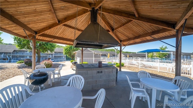 611 Lazy Days Rd Unit X-10, Osage Beach, MO 65065 - view of patio with outdoor dining area, fence, and a residential view