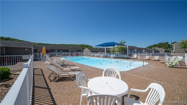 611 Lazy Days Rd Unit X-10, Osage Beach, MO 65065 - community pool with fence and a patio area