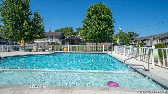 611 Lazy Days Rd Unit X-10, Osage Beach, MO 65065 - community pool featuring fence and a residential view