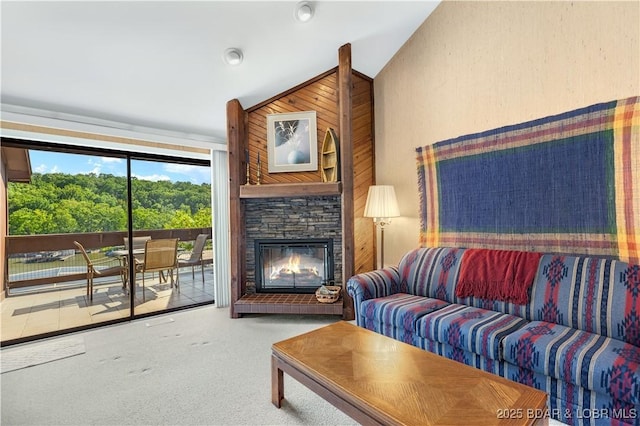 5940 Baydy Peak Rd Unit 932, Osage Beach, MO 65065 - carpeted living area with lofted ceiling, a stone fireplace, and wood walls