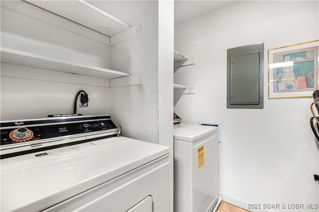 5940 Baydy Peak Rd Unit 932, Osage Beach, MO 65065 - laundry area featuring electric panel and washer and clothes dryer