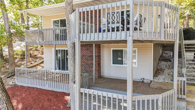 42 Buttercup Rd, Lake Ozark, MO 65049 - back of house with brick siding