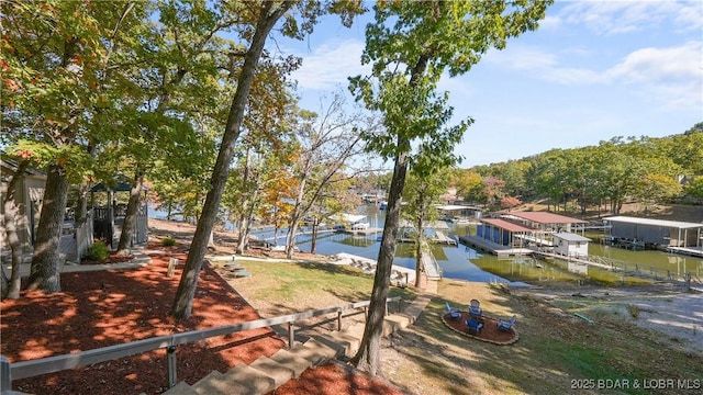 42 Buttercup Rd, Lake Ozark, MO 65049 - view of yard featuring a floating dock and a water view